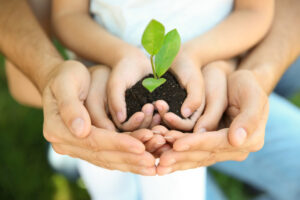 Mother Holding Sapling with Child.